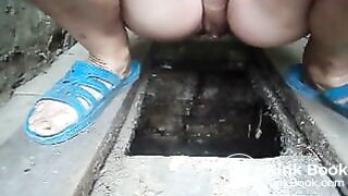 Woman from Ukraine shit in primitive toilet