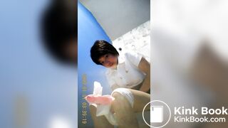 Thai Woman sitting shit in the bathroom