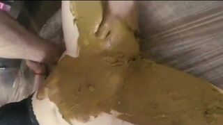 Smearing shit on her pussy