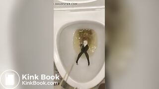 piss anime figure in public toilet