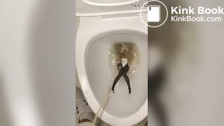 piss anime figure in public toilet