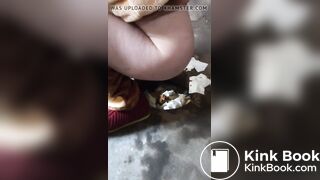 woman with a gorgeous ass shitting in a toilet built on the street