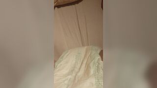 Babygirl loading her nappy