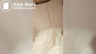 Babygirl loading her nappy