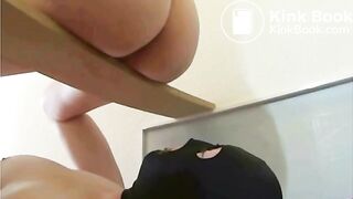 domme perched on board scat in slaves mouth