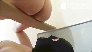 domme perched on board scat in slaves mouth