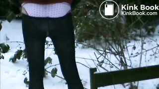 Woman shitting in snow