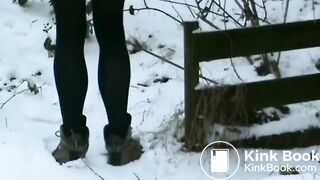 Woman shitting in snow