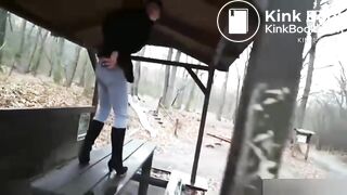 girl shit in rainy weather outdoors and her friend takes pictures on camera