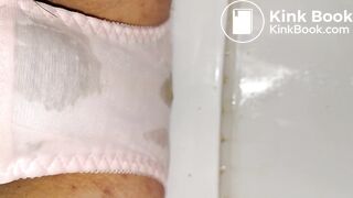 Wetting this lovely pink flower pattern panty.