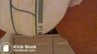 Girl poops diaper and plays