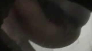 Girl in green bikini takes a dump in a public toilet.