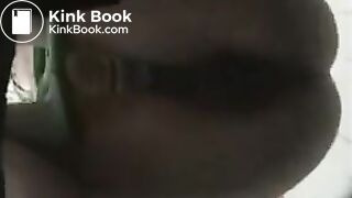 Girl in green bikini takes a dump in a public toilet.