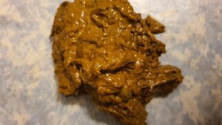 Soft, gassy shit on the floor.