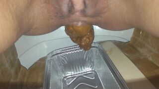 Huge turd into plastic container