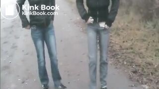 2 Girls pooping on a public road