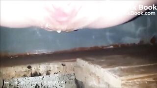 girl is pooping on outdoor toilet