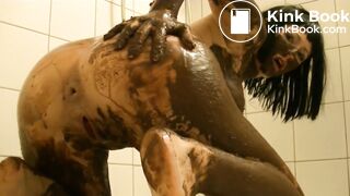 Gorgeous woman covers her body in shit