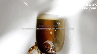 beautiful sexy blonde with a mask crapping peeing