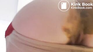 beautiful sexy blonde with mask crapping and peeing