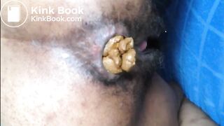 Hairy girl shitting an hard turd