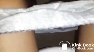 Girl having diarrhea in the toilet