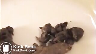Woman shit big turd on a white plate