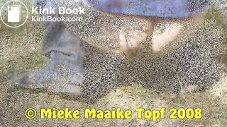 Female shitting in the dunes