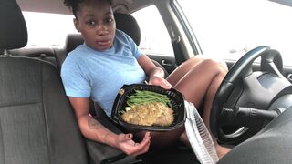 A black chick pooping in her car.