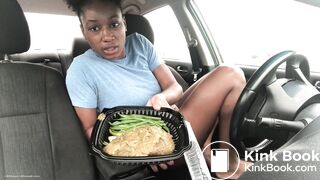 A black chick pooping in her car.