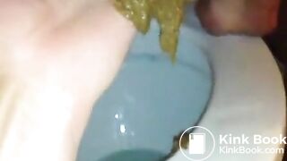 Guy fingers girls anus while she shits
