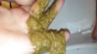 Guy fingers girls anus while she shits