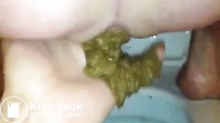 Guy fingers girls anus while she shits