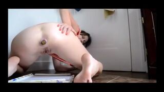 woman pooping into container - video 7