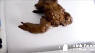 woman pooping into container - video 7