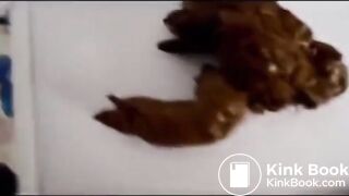 woman pooping into container - video 7