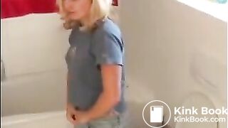 Sexy blonde girl shitting in the toilet