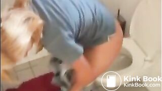 Sexy blonde girl shitting in the toilet