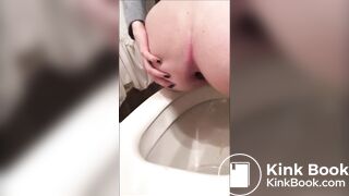 Girl is doing an hard turd of shit in toilet