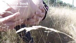 Pushing out a nice big turd in a field