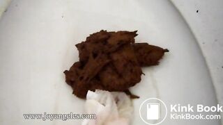 Iris pooping on the toilet