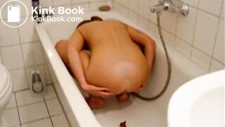 Skinny girl doing enema to herself