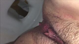 Hairy girl shitting in the toilet