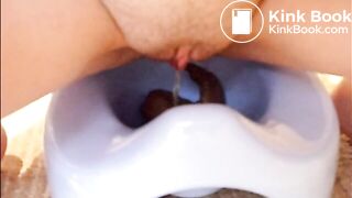 girl pooping into potty