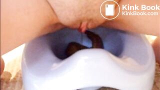 girl pooping into potty