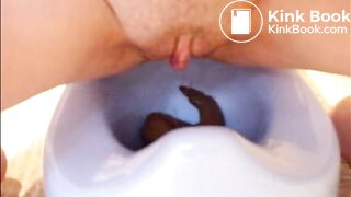 girl pooping into potty