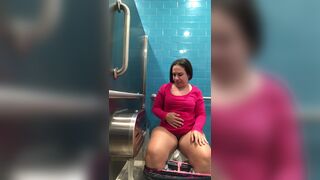 Pink shirt woman public toilet poop