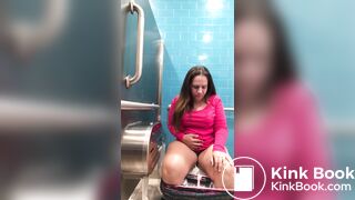 Pink shirt woman public toilet poop