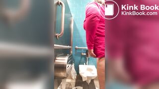 Pink shirt woman public toilet poop