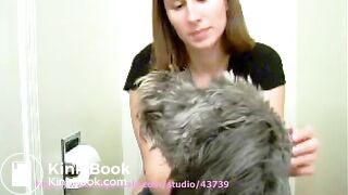 Woman pooping with her dog